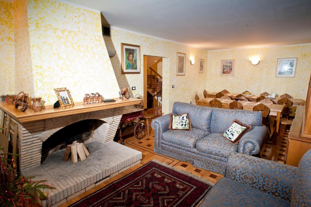 a living room with a couch and a fireplace at U Gabryla in Biały Dunajec