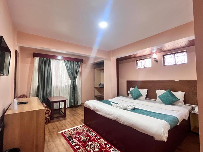 En eller flere senge i et værelse på Rare Himalayas Mansarovar