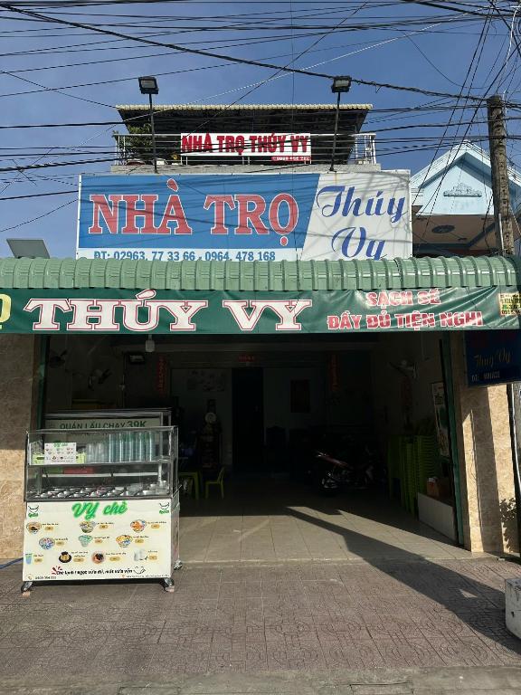 a store with a sign that reads nina tri top at Nhà Trọ Thuý Vy in Tri Tôn