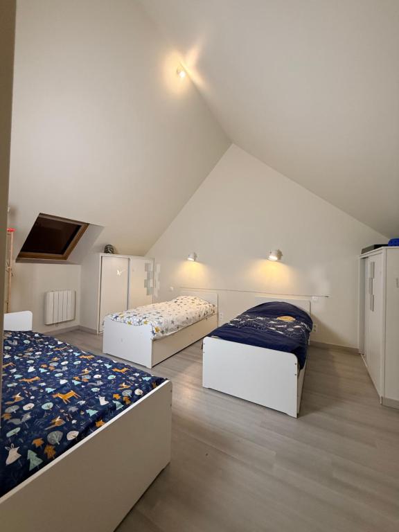 Postel nebo postele na pokoji v ubytování L'escale Granvillaise