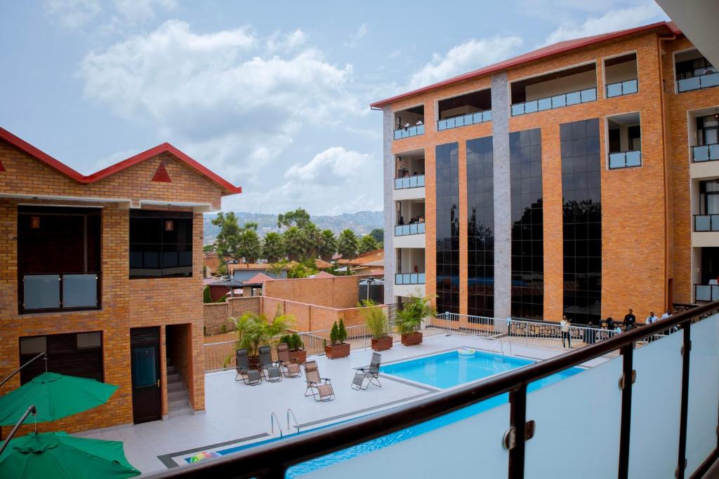 a balcony with a pool and a building at Pallotti Hotel in Kigali