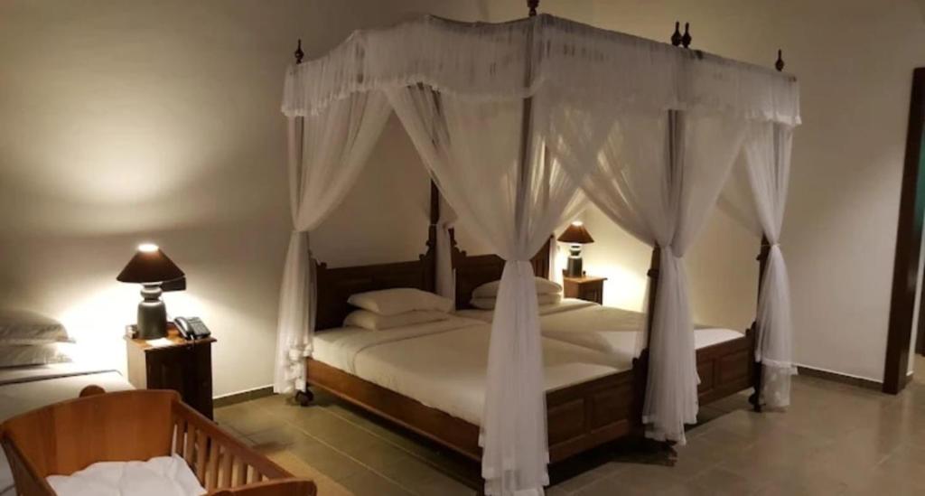 Ένα ή περισσότερα κρεβάτια σε δωμάτιο στο Forest Rock Garden Resort