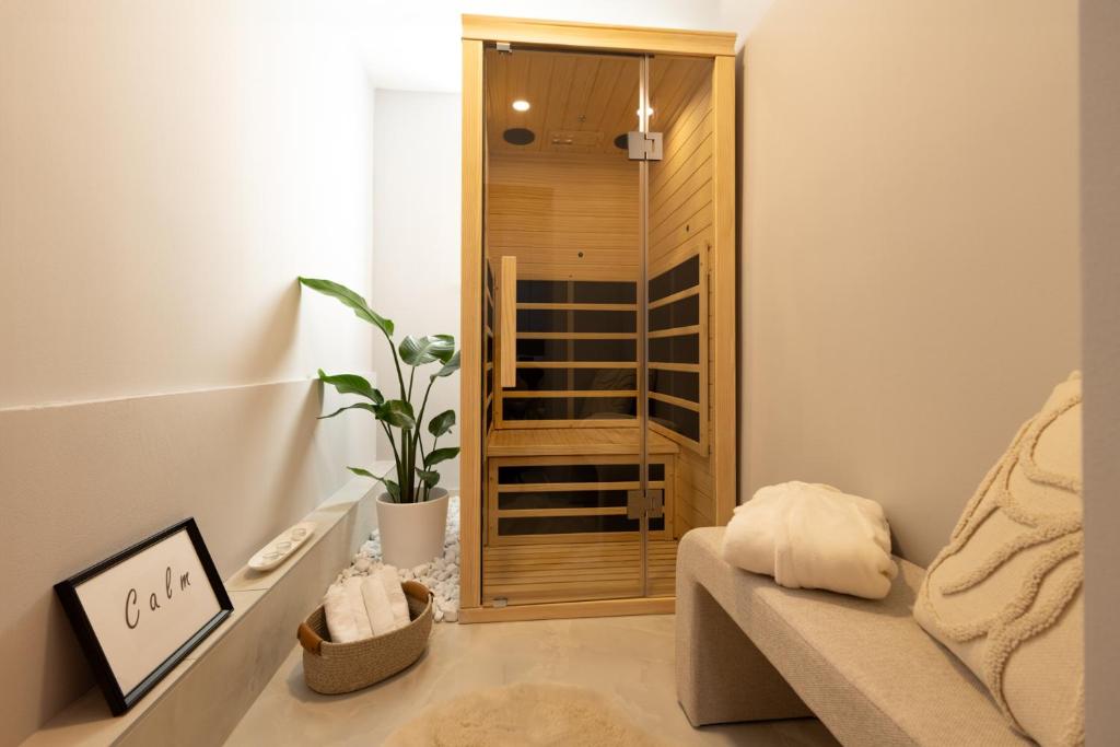 a living room with a couch and a glass door at Apartments Lia in Ljubljana