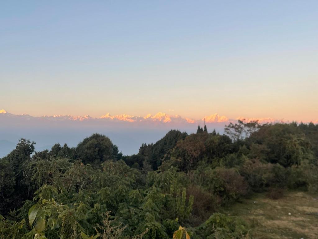 a view of the mountains from the top of a hill at Aanshi homestay in Nagarkot