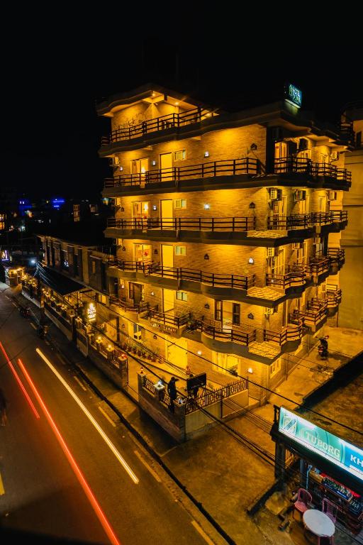 a large building with lights on the side of a street at Hotel Dream Light in Pokhara