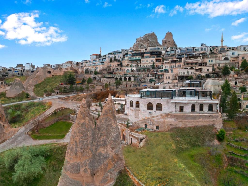an aerial view of a village on a mountain at CCR Cappadocia Cave Resort &Spa in Eskiömerler