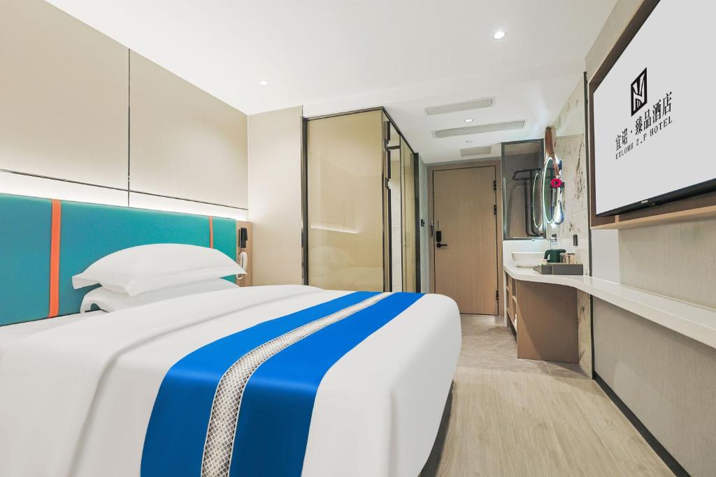 Ένα ή περισσότερα κρεβάτια σε δωμάτιο στο Yinuo Premium Hotel, Guangzhou Zhongshan University Eye Hospital Quzhuang Metro Station Branch