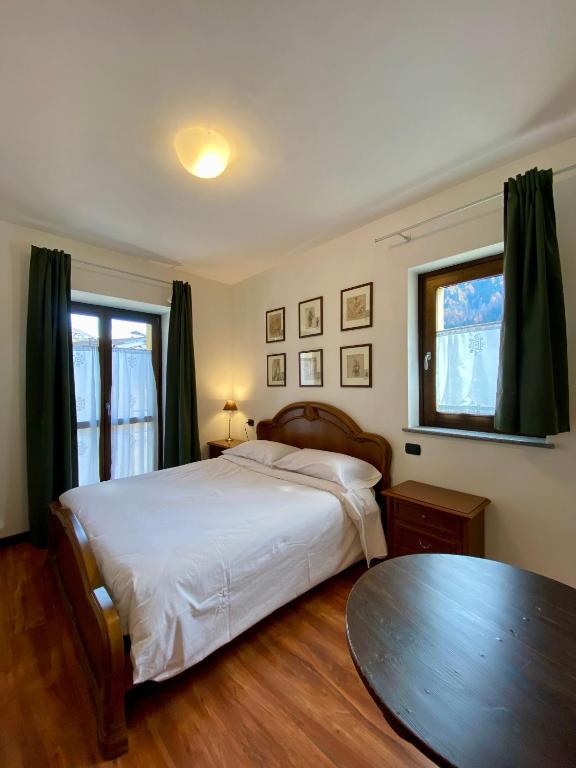 Ένα ή περισσότερα κρεβάτια σε δωμάτιο στο La Casa Dei Nonni