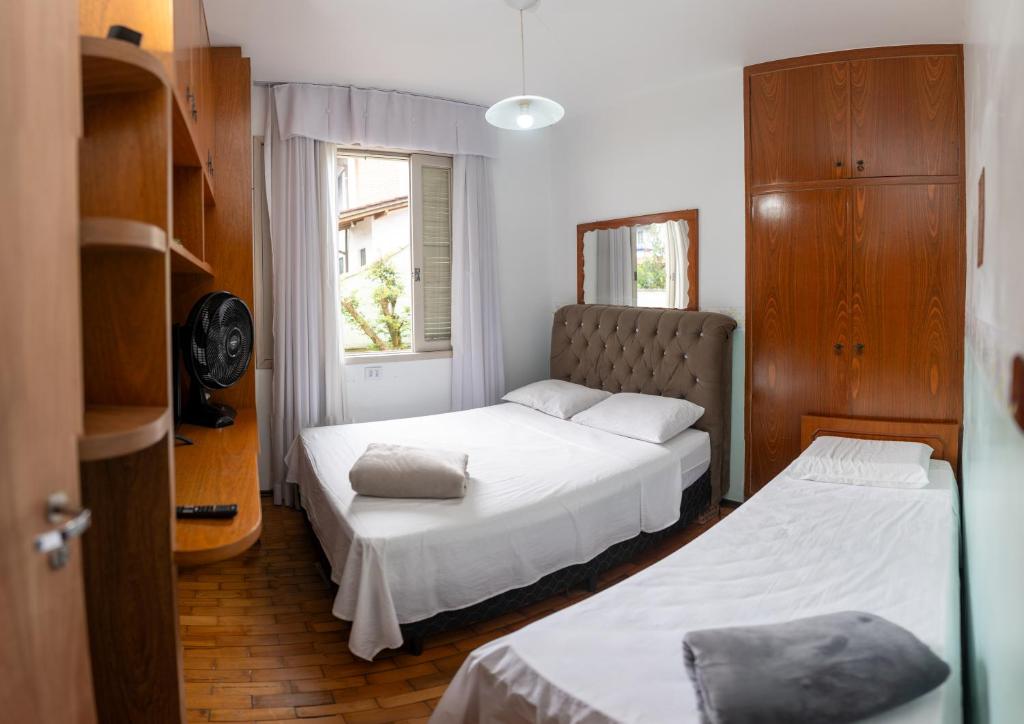 Postel nebo postele na pokoji v ubytování American Hostel e Pousada