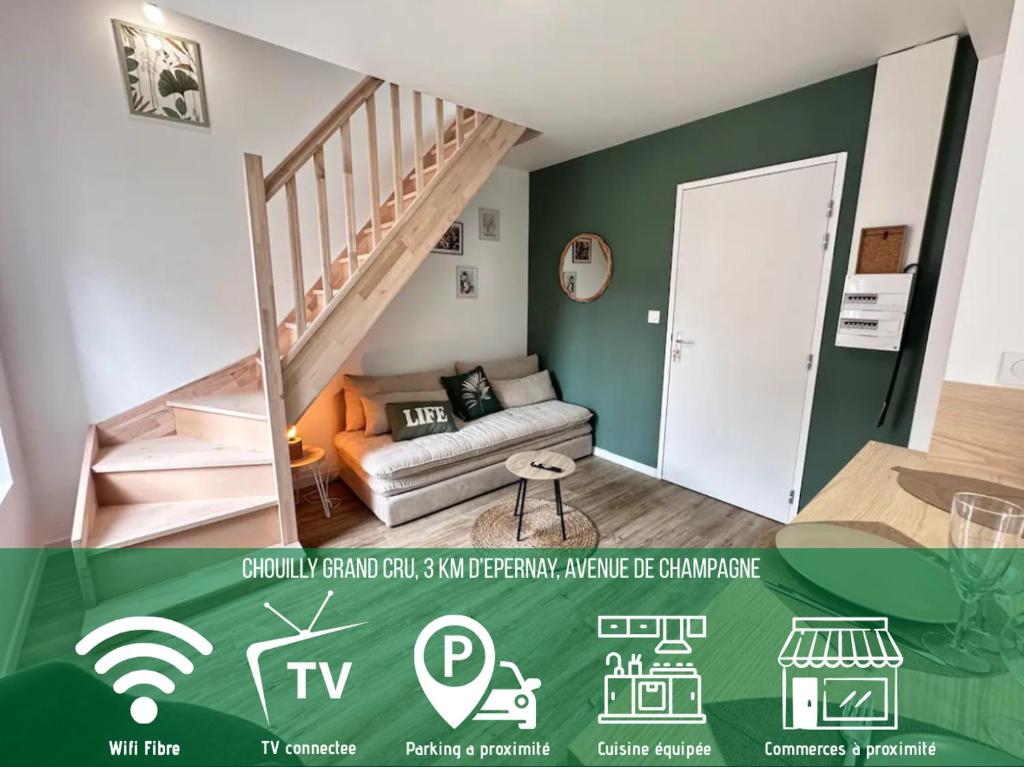 a living room with a staircase and a couch at Le Pinot in Chouilly