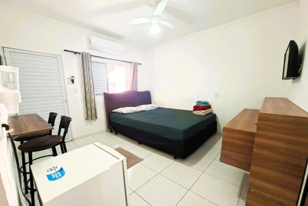 Кровать или кровати в номере Pousada Casa da Fernanda, Suíte Sun