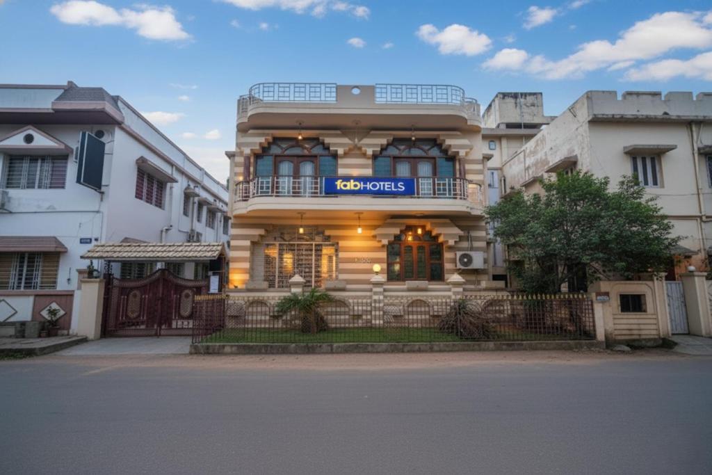 a building with a sign on the front of it at FabHotel Heritage Inn in Kolkata