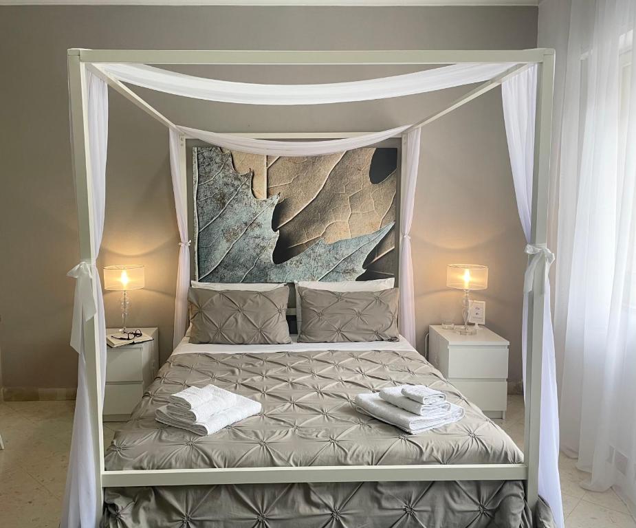 Postel nebo postele na pokoji v ubytování Al Politeama Rooms B&B