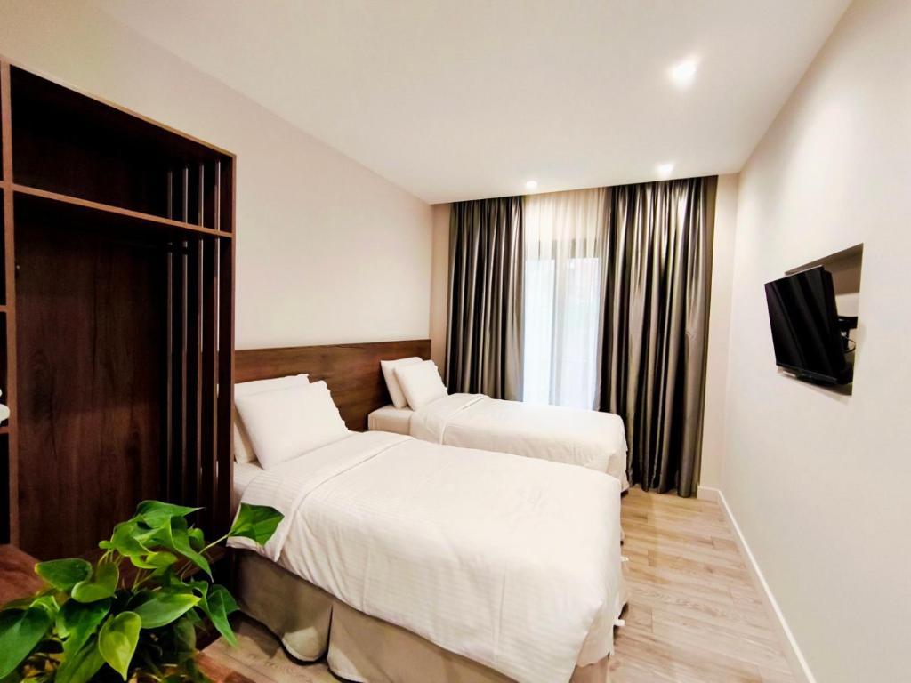 Postel nebo postele na pokoji v ubytování D Suites & Rooms