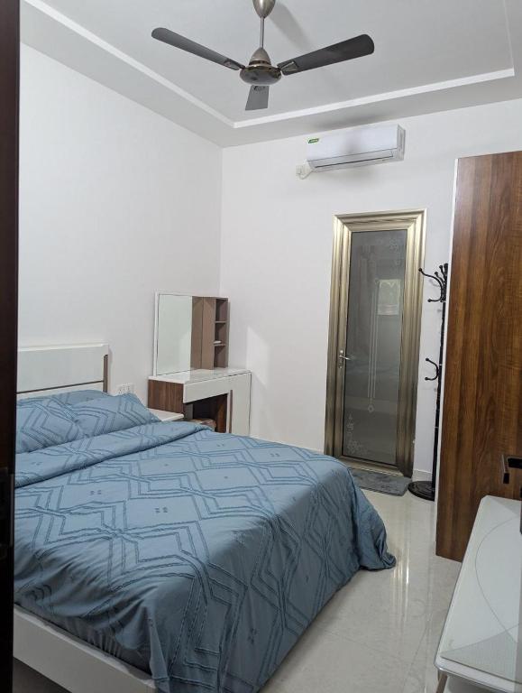 Ένα ή περισσότερα κρεβάτια σε δωμάτιο στο Thooran Homestay, B&B