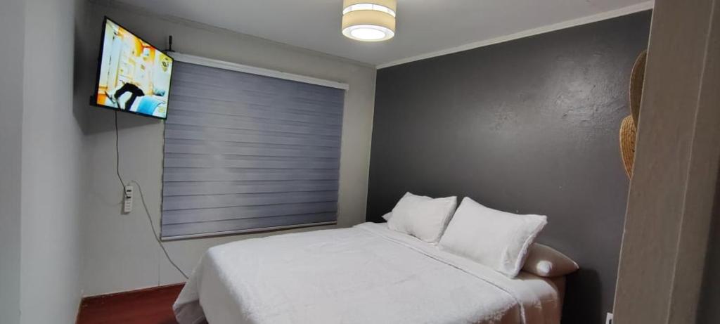 Ένα ή περισσότερα κρεβάτια σε δωμάτιο στο Departamento El Llano