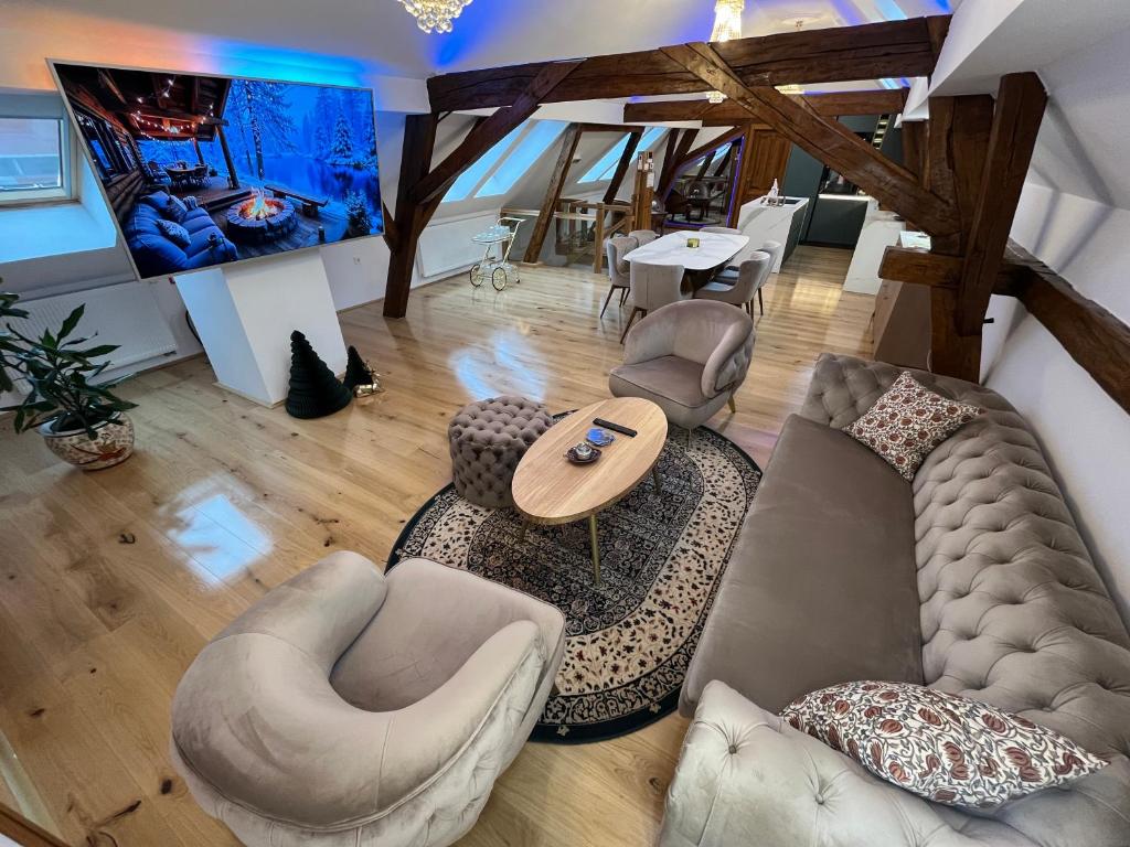 an overhead view of a living room with a couch and chairs at La Luna Royal Deluxe Luxury House with Pool & Jacuzzi, Bikes and Covered Parking in Našice