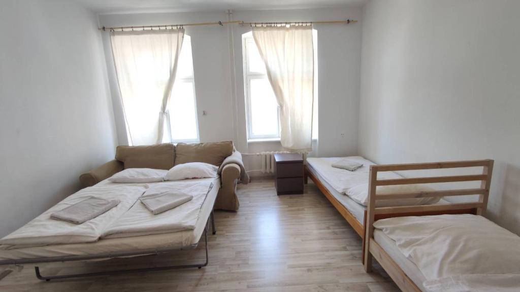 En eller flere senge i et værelse på Botanic Garden Private Room