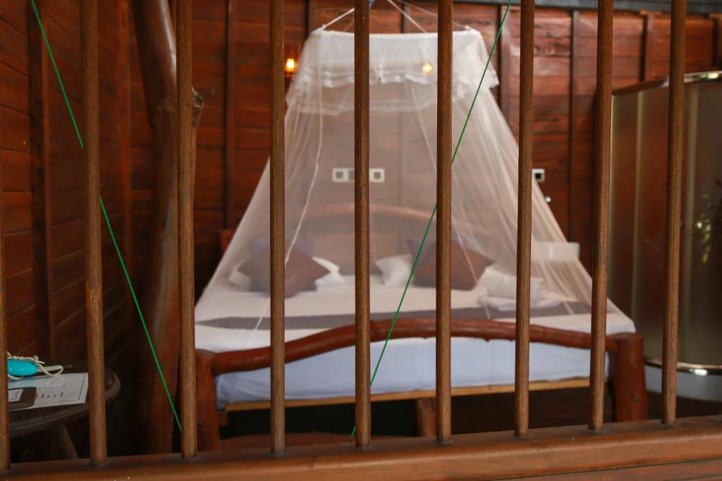 Postel nebo postele na pokoji v ubytování Coco Palm Villa and Cabanas