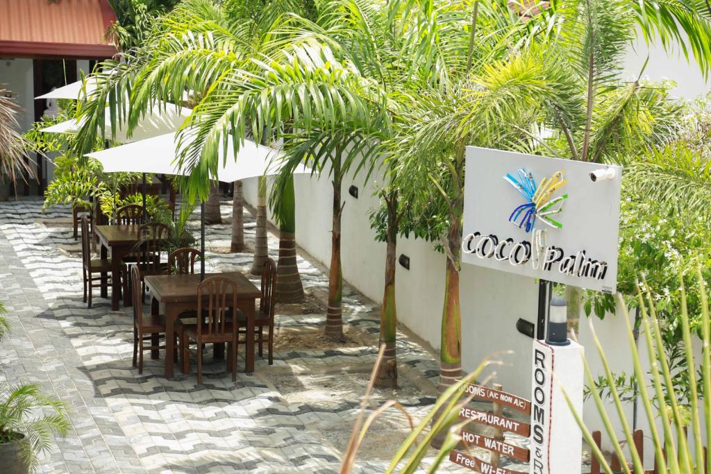 Restaurace v ubytování Coco Palm Villa and Cabanas