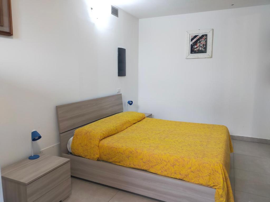 Ένα ή περισσότερα κρεβάτια σε δωμάτιο στο R. & M. RELAX Appartamento con giardino, barbecue