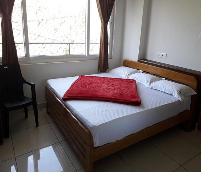 Ένα ή περισσότερα κρεβάτια σε δωμάτιο στο Dream View INN