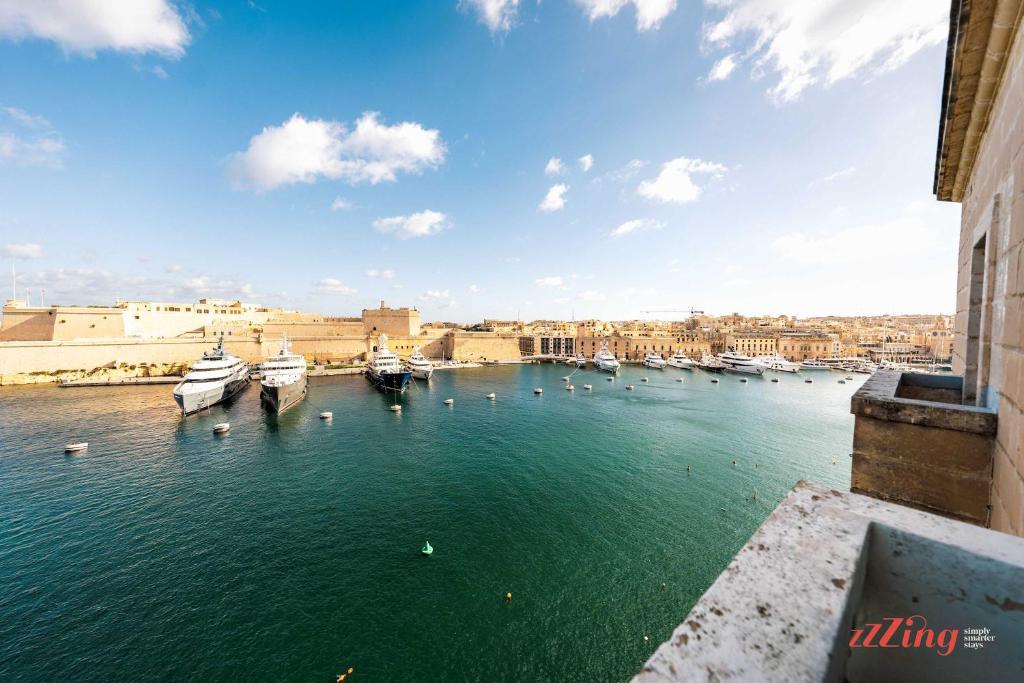a view of a harbor with boats in the water at Stunning Holiday Home with Gorgeous Harbour Views in Senglea