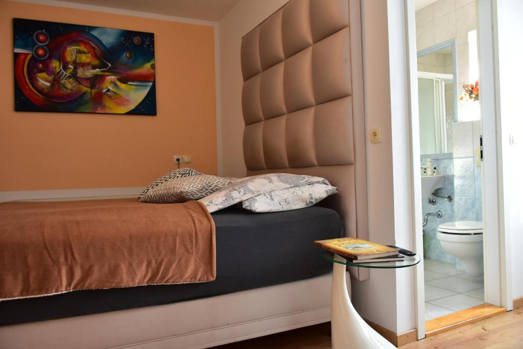 Ένα ή περισσότερα κρεβάτια σε δωμάτιο στο Sobe - Rooms Stremljan Ljubljana