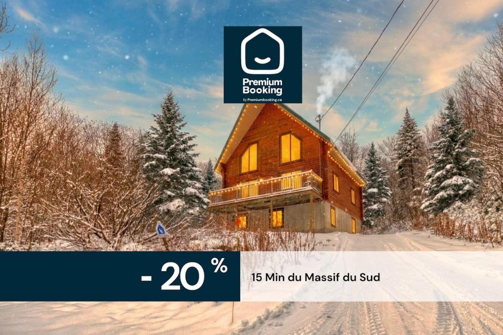 a picture of a wooden house in the snow at Chalet Cerf for 16 Guests, 7 min to SPA, Skiing in Saint-Paul-de-Montminy