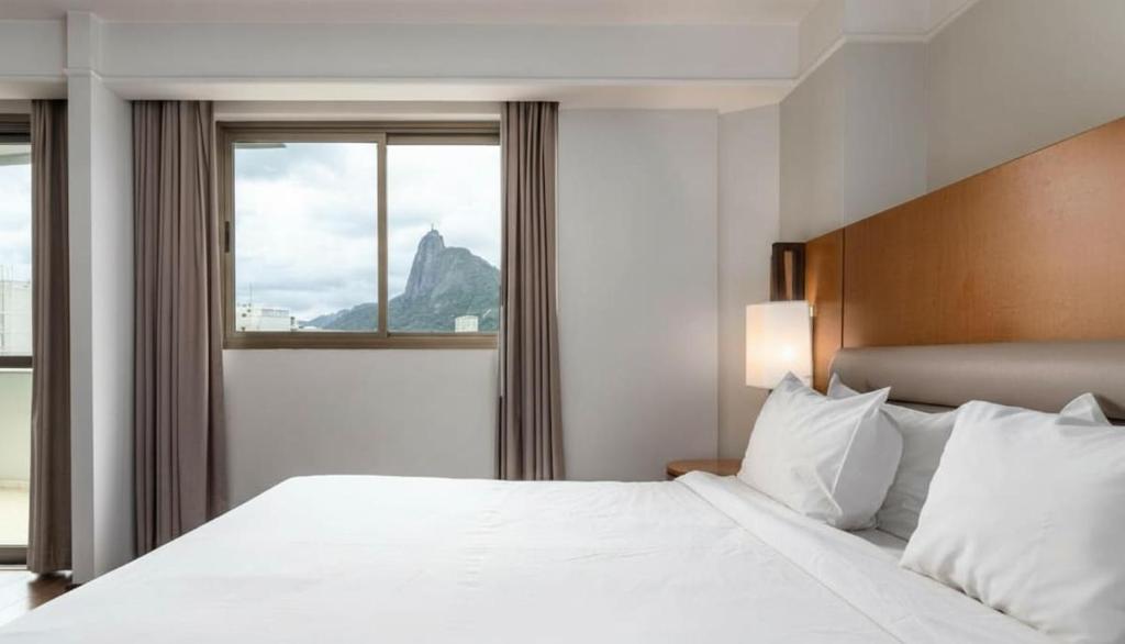 Кровать или кровати в номере Studio Corcovado