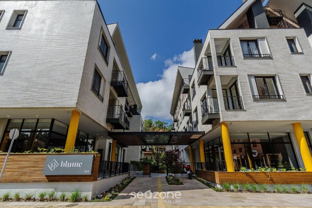 a couple of buildings next to each other at Acomodações modernas e completas no centro turístico de Gramado - CBGs in Gramado