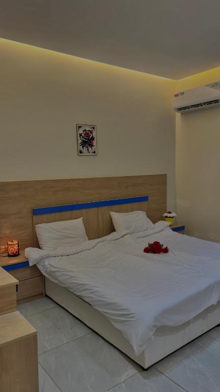 Ένα ή περισσότερα κρεβάτια σε δωμάτιο στο Apple Plus Resort