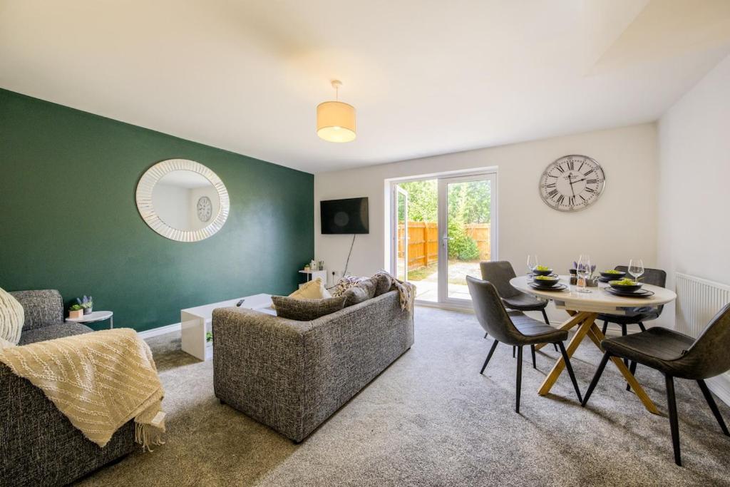 a living room with a couch and a table at NEW! Private Driveway, Spacious, 2 Bathroom, Fast WiFi in Berkswell