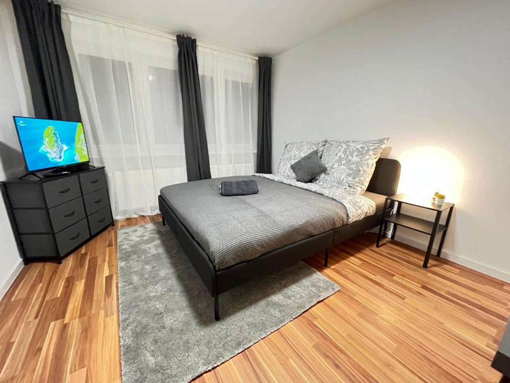 En eller flere senge i et værelse på FlexStay Room 8