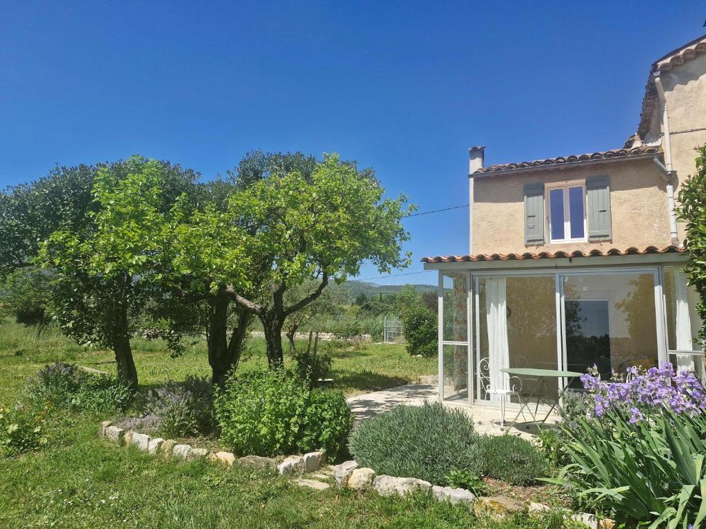 a house with a garden in front of it at La Bastideta, in Fayence