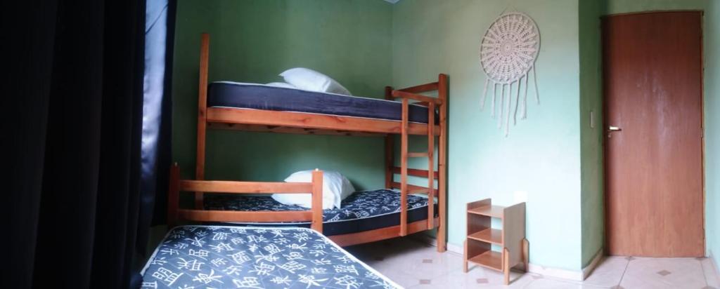 En eller flere senge i et værelse på Paúba House