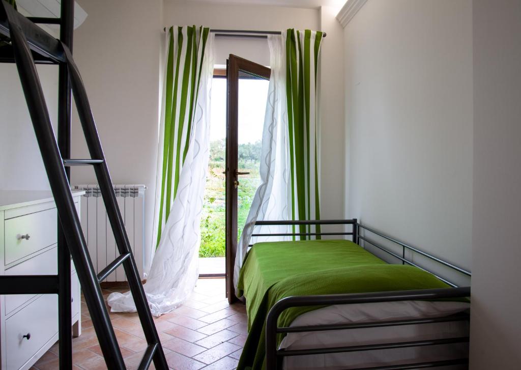 Postel nebo postele na pokoji v ubytování Agriturismo Sensi