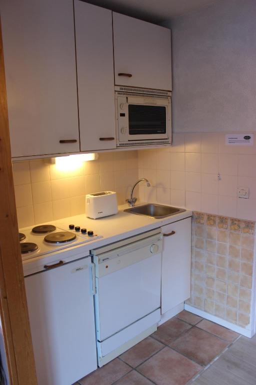 Kuchyň nebo kuchyňský kout v ubytování Reine Blanche Appartements VTI