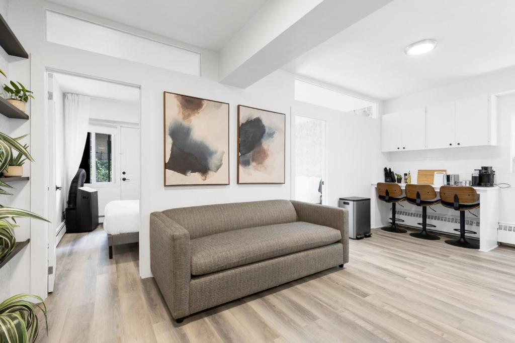 a living room with a couch and a table at The Sherbrooke Suite in Montreal
