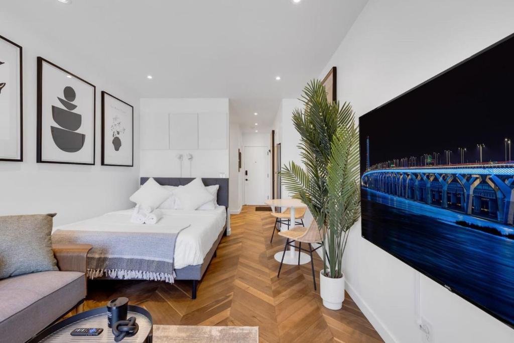a hotel room with a bed and a couch at The Speakeasy Suite 502 With Parking in Montreal