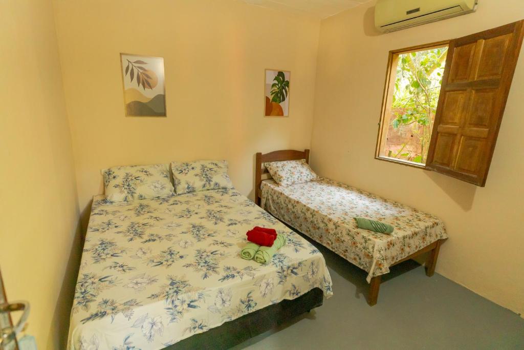 Ένα ή περισσότερα κρεβάτια σε δωμάτιο στο Pousada Raízes da Mata