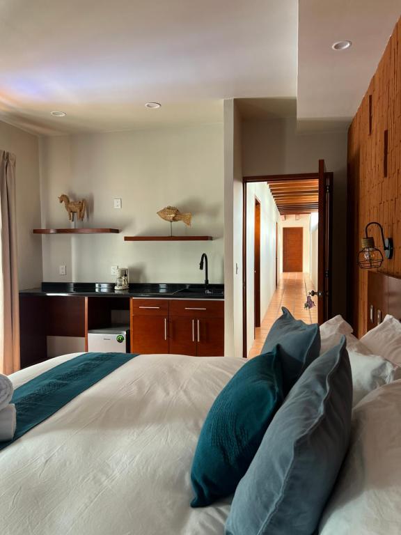 Postel nebo postele na pokoji v ubytování Hotel Boutique Casa Gopar