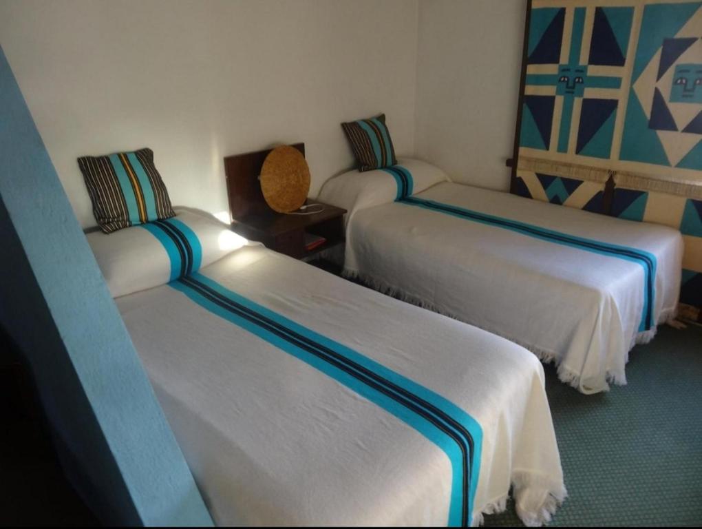 Ένα ή περισσότερα κρεβάτια σε δωμάτιο στο Tana hotel