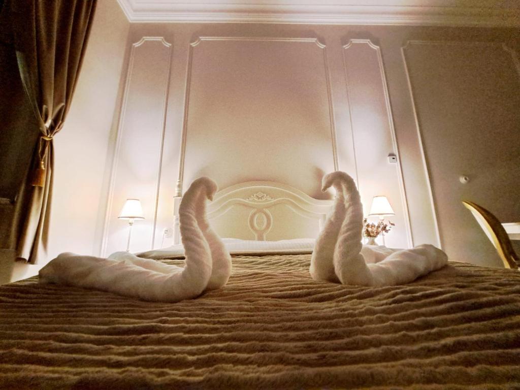 Postel nebo postele na pokoji v ubytování Poznaj Mickiewicza 1