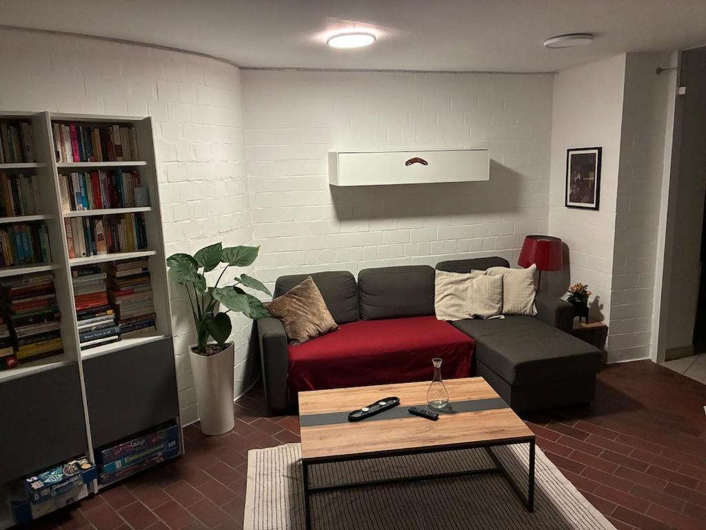 a living room with a couch and a coffee table at Apartment in Heidelberg with Neckar view in Niederdorla