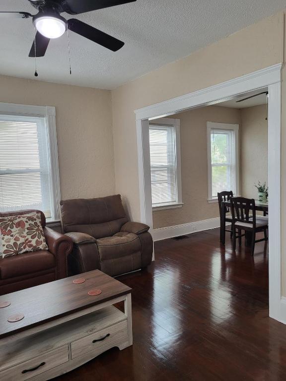 a living room with a couch and a table at Apt 1 Stylish First Floor Apartment in Worcester