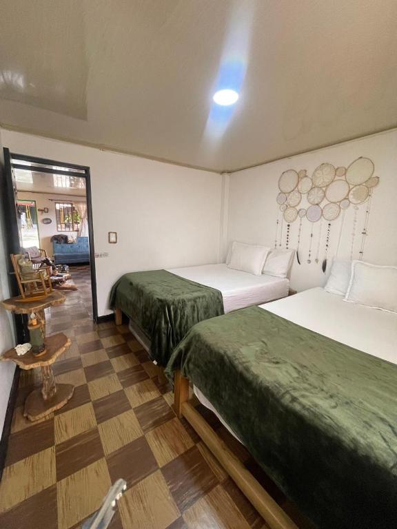 Ένα ή περισσότερα κρεβάτια σε δωμάτιο στο Casa hospedaje