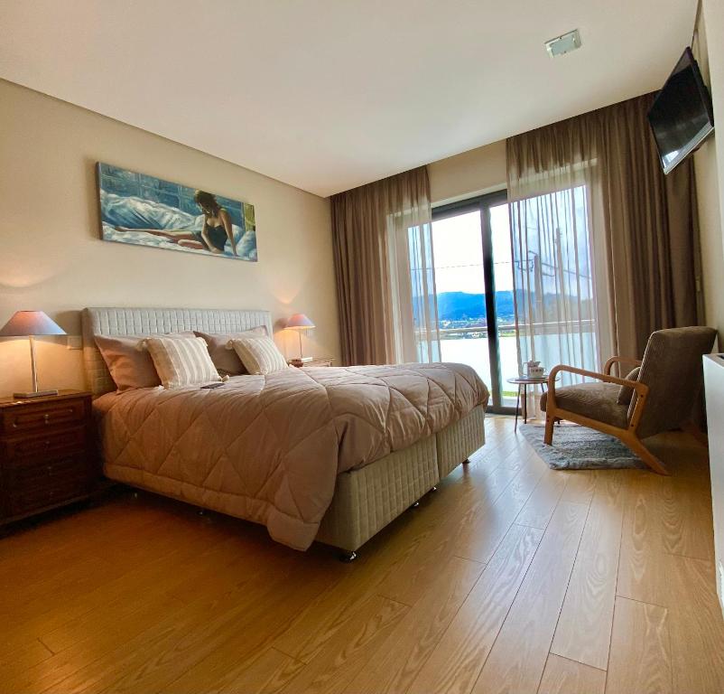 Ένα ή περισσότερα κρεβάτια σε δωμάτιο στο Casa d'Avó Dete, Férias no coração do Minho