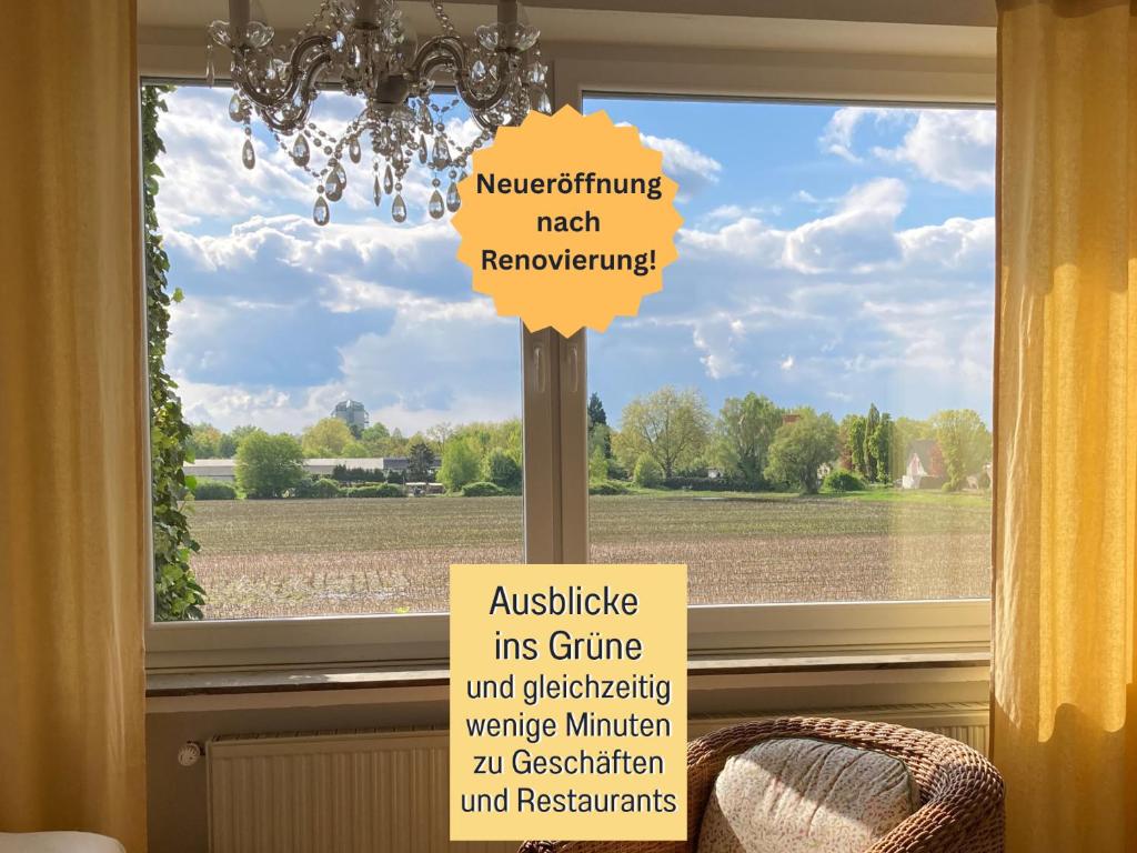 a sign on a pole in front of a window at Ferienwohnung am Maximilianpark Hamm in Hamm