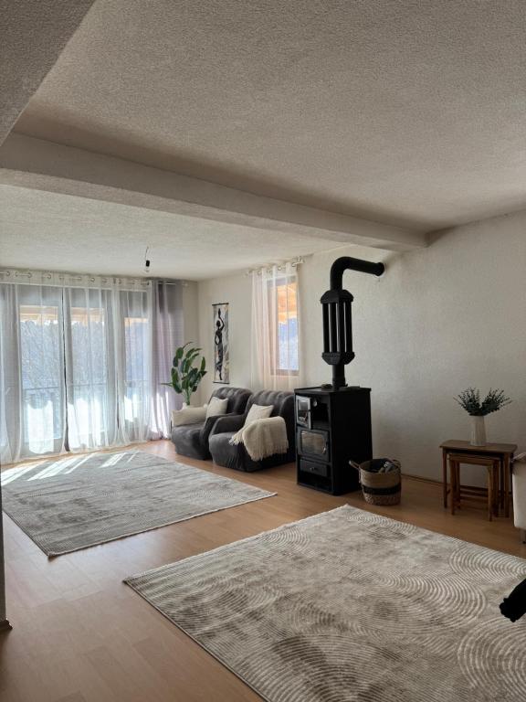 a living room with a couch and a fireplace at Mountain villa in Gorna Belica - Villa Hani in Struga